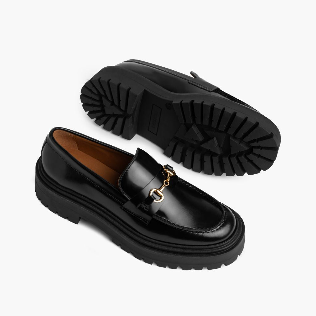 High-Traction Rubber Outsole & Lug Tread Pattern on Penny Platform Negro & Gold Mocasines de cuero para Mujer