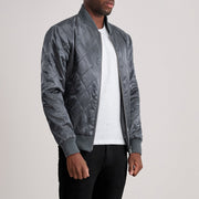 
Grey Satin Varsity Jacket - Vista posterior con hombros definidos y bajo impecable