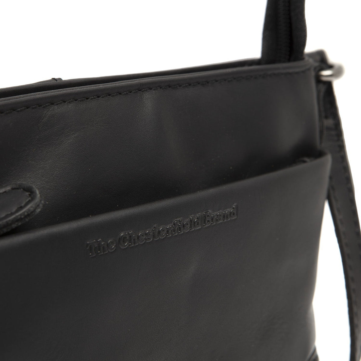 
Solid Antique Brass Hardware & Heavy-Duty Dual Zipper Detail on Salerno Bandolera de cuero flor