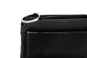 Oliver Full-Grain Leather Key Case para Mujer - Vista de perfil lateral con corte ergonómico de manga