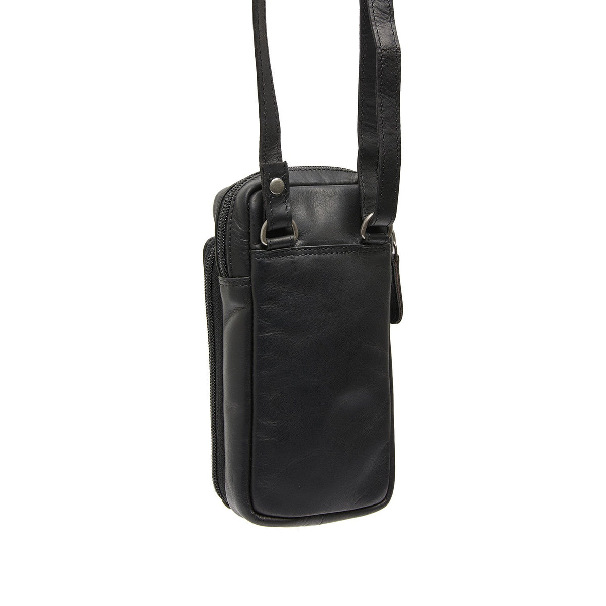 
Perspectiva del modelo vistiendo Valdes Cuero Flor Integral Phone Bag en modelo con caída natural bajo luz de día