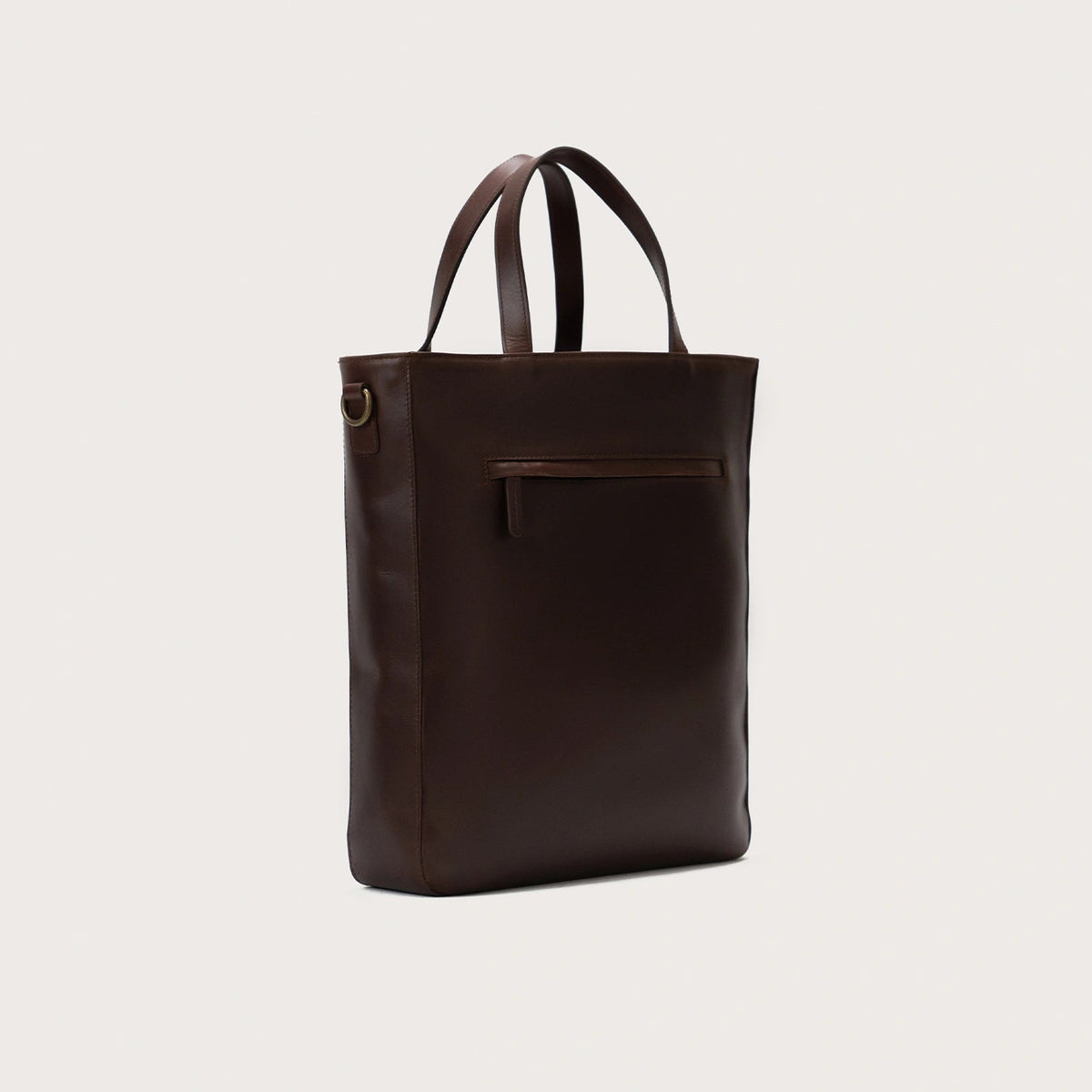 
The Poet Vintage Brown Leather Tote Bag For Men & Women - Perfil lateral estructurado con profundidad de fuelle