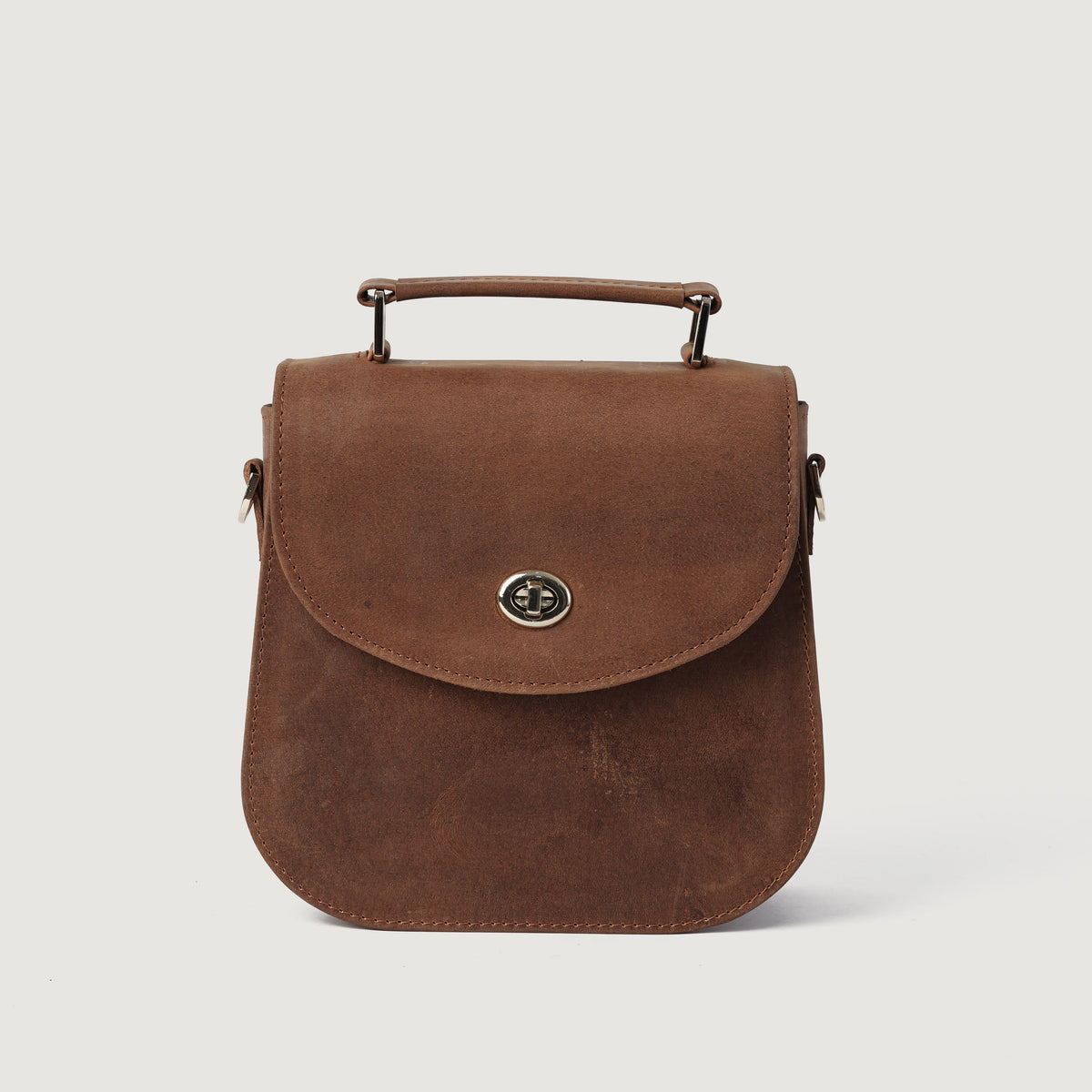 
The Sandra Vintage Tostado Leather Saddle Bag For Women - Perfil lateral estructurado con profundidad de fuelle
